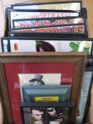 A collection of framed and glazed LP album covers.