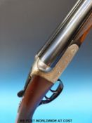 A Midland Gun Company 12-bore side-by-side shotgun with scrolling engraved cartouche to the locks,