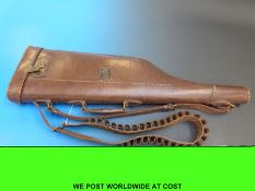 A leather leg of mutton gun case and cartridge belt