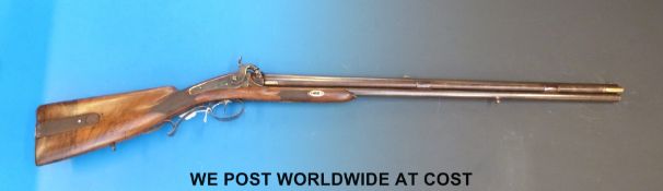 Franz Baader over and under hammer action gun with carved storage compartment to stock,