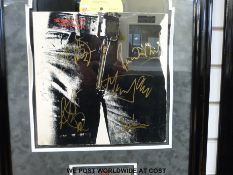 An autographed montage of the Rolling Stones album Sticky Fingers.