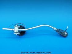 An incomplete stylus arm, made in Denmark.