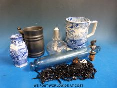 A blue glass rolling pin, a large spirit lamp, a Prinknash tankard, bottle top metal lady,
