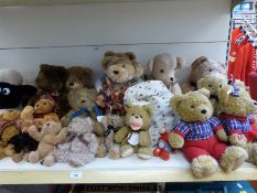 Twenty-four various soft toys and bears including two singing bears, an Andrex dog,