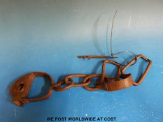 A set of wrought iron slave leg irons, likely North African.