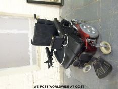 A Quicke mobility scooter with charger