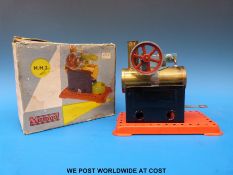 A Mamod MM2 over type live steam engine with cardboard box and vapourising burner