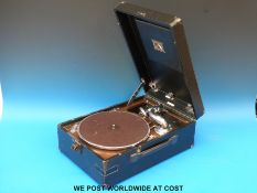 A c1930's HMV portable wind up gramophone.
