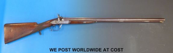 Squires side by side hammer action muzzle loading gun with ornate engraving to the locks and