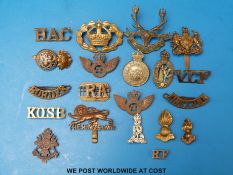 A quantity of military badges to include Barrow & North Lonsdale,