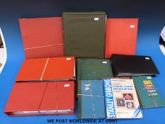 A box containing various first day cover albums, albums of world stamps,