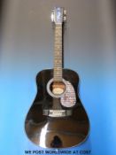 Hondo model H-124-12B 12-string acoustic guitar in black laquered finish with soft case