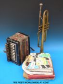 A German single row c1910 melodeon together with a Boosey & Hawkes Ltd trumpet and a quantity of 78
