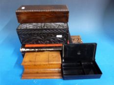 A wooden desk top ink stand, a small carved book slide,
