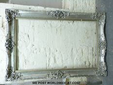 A large silver picture frame (overall size 123 x 183cm)