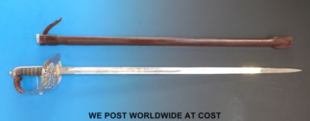 A QEII infantry officer's dress sword in scabbard.