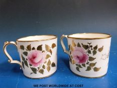 A pair of Victorian bone china wedding mugs / beakers dated 1851 with hand painted floral design,