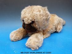 A mohair pyjama case formed as a dog