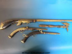 A pair of replica pistols with brass fittings,