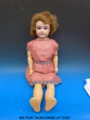 A Societe de Fabrication des Bébés et Jouets (SFBJ) bisque headed doll with open mouth,