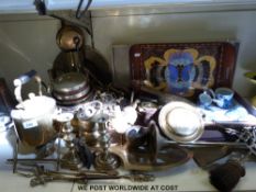 A large collection of brassware to include a tea pot and stand, bellows, candlestick, shell case,