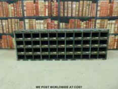 A wooden set of vintage parts drawers or pigeon holes of haberdashery/shop fitting interest (length