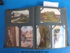 An Edwardian postcard album containing cards Edwardian - 1970's including Cheltenham, humorous, WWI,