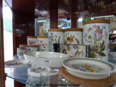 A collection of Portmeirion storage jars, tea pot stand,