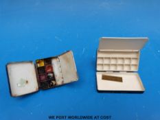 A small Winsor & Newton travelling watercolour box,