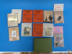 A handmade album of cards, several foreign translations of Peter Rabbit,