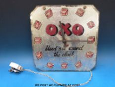 An 'Oxo used all round the clock' electric wall clock with Sectric movement (approximately 30cm