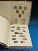 A collection of Great Britain Commonwealth and foreign stamps in two large loose leaf albums.