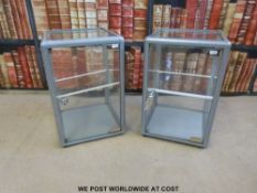 A pair of metal framed lockable display cabinets (W30 x D30 x H46cm)