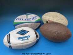 Four signed rugby balls