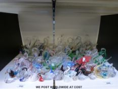 A collection of mainly glass swans (approximately 90) some fish and three small flying geese