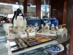 A collection of crested ware including Goss, Carlton ware, Wedgwood,