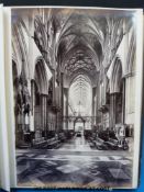 A portfolio of photographs with prints including African tribes and village,