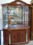 A glazed and mirrored display cabinet with glazed back to top section and parquetry effect lower