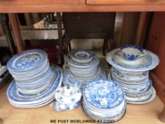 A large collection of blue and white ceramics including Staffordshire Willow pattern,