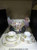 A quantity of ceramics to include Nao figure, Wedgwood Art Deco trio,