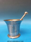 An 18th century bronze pestle and mortar