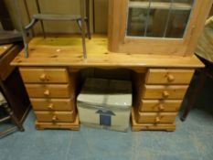 A pine twin pedestal desk (W144 x D53 x H78cm)
