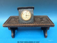 A carved bookslide and travelling clock