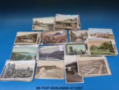 A large collection of West Country postcards including Tuck oilettes of Clovelly,