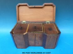 An inverted breakfront Georgian mahogany tea caddy with line inlay,