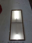 A gilt framed mirror (40 x 112cm overall)