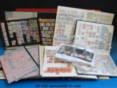 A box of stamps of North and South American countries in stock books and loose