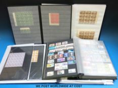 Three stockbooks of mainly mint blocks of GB stamps and a larger album of complete and part sheets