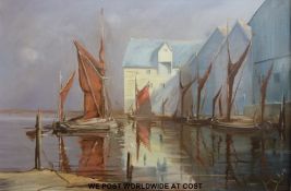 Oil on canvas sailing barges beside warehouses,