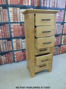 A modern light oak chest of six drawers (H115 x W51 x D37cm)